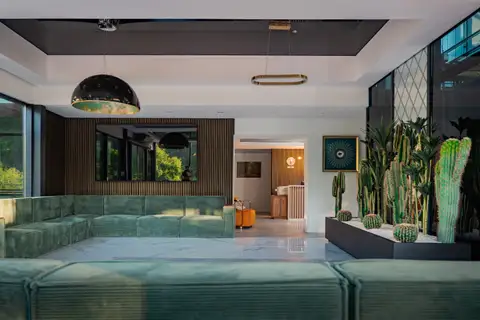 The lobby with green sofas
