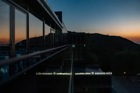 The hotel terrace at sunset overlooking the hills