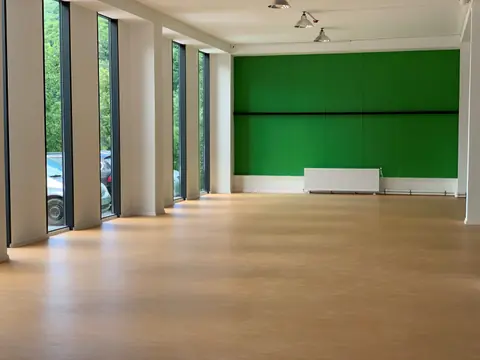 The fitness room with tall windows