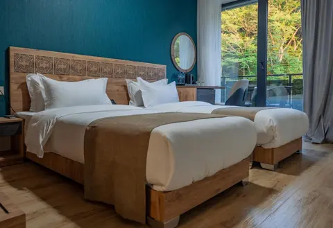 A room with two single beds